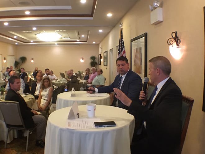 State Rep. Paul Renner, right, talks about the recently completed legislative session with Sen. Travis Hutson at the Flagler County Chamber of Commerce Common Ground breakfast Thursday, May 23. [News-Journal/Aaron London]