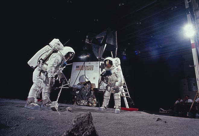 In this 1969 file photo, astronauts Edwin E. Aldrin and Neil Armstrong rehearse tasks they will perform on the moon after landing in July 1969 during the Apollo 11 mission. [AP Photo/NASA, File]