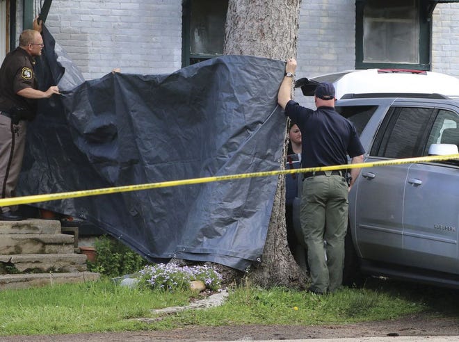 The dismembered body of Kelly-Jien Warner-Miller found in an apartment on North Maple Street was removed from the home and taken to Kalamazoo for an autopsy. Wade Allen, 35, was arrested in connection with the case.