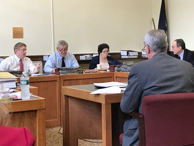 Members of the Legislative Budget Assistant’s staff go over budget figures with members of the Senate Finance Committee. Visible are, from left, Sens. Dan Feltes, D-Concord, Lou D’Allesandro, D-Manchester, Cindy Rosenwald, D-Nashua, and Jay Kahn, D-Keene. Other committee members not pictured are John Reagan, R-Deerfield, and Bob Giuda, R-Warren. [Garry Rayno photo]