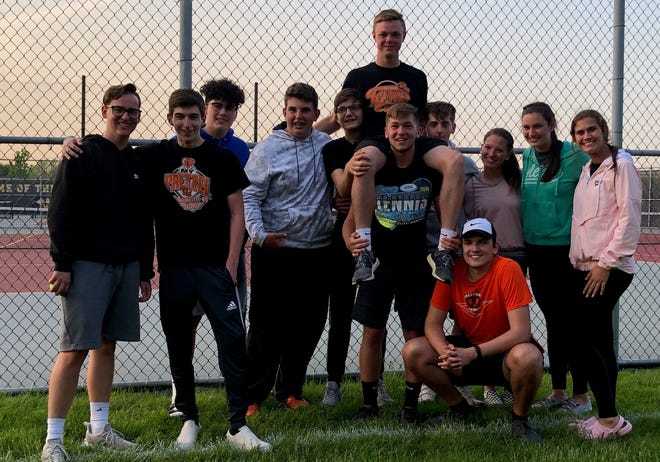 Freeport junior Preston Engel, hoisted on a friend's shoulder, poses with teammates and friends, who cheered him on Friday as he became the first Pretzel in 23 years to reach the final day of the state boys tennis tournament. [PHOTO PROVIDED]