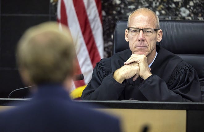 Palm Beach County Circuit Judge Jeffrey Colbath in March listens as defense attorney Douglas Duncan argues for a reduced sentence for former Wellington polo mogul John Goodman. Colbath denied the request. [LANNIS WATERS/palmbeachpost.com]