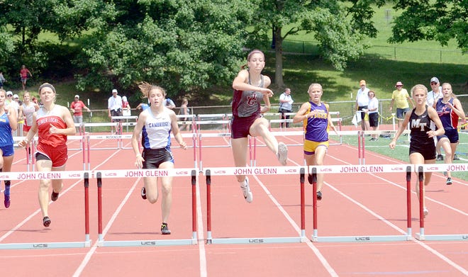 Cambridge's Jaylynn McClarren and John Glenn's Abby Walker compete in the girls' 300 meter hurdles during the OHSAA Region 7 Regional Track & Field Championship Saturday at Muskingum University in New Concord.