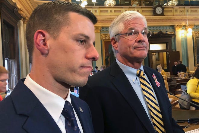 Republican House Speaker Lee Chatfield, left, and Republican Senate Majority Leader Mike Shirkey speak with reporters following the Michigan Legislature's approval of auto insurance legislation Friday at the Capitol in Lansing. Democratic Gov. Gretchen Whitmer is expected to sign the bill.