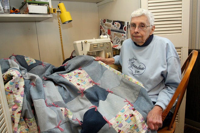 Mary Lobdell shows on Monday, May 13, 2019, in her Lena home the 24th quilt she has made; all were given to her grandchildren. [JANE LETHLEAN/THE JOURNAL-STANDARD CORRESPONDENT]