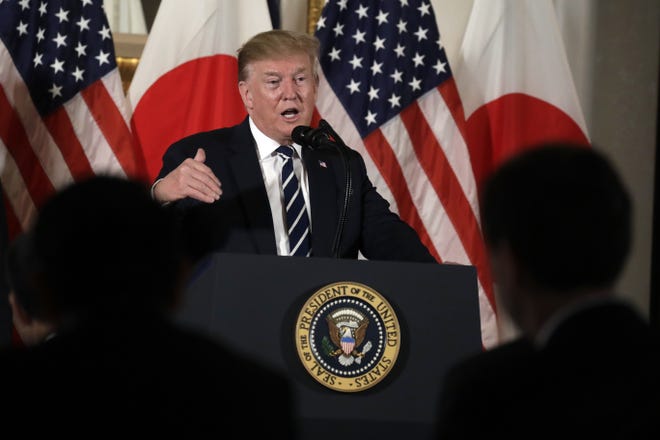 President Donald Trump speaks as he meets with Japanese business leaders Saturday in Tokyo. [EVAN VUCCI/THE ASSOCIATED PRESS]