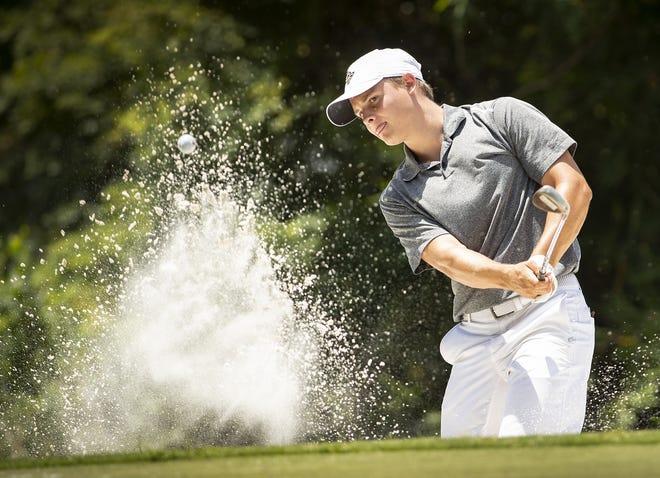 Colin Kresl blasts a shot out of the bunker while playing in the opening round of the 2019 Youth Villa golf tournament at Bartow Golf Course in Bartow. [ERNST PETERS/THE LEDGER]