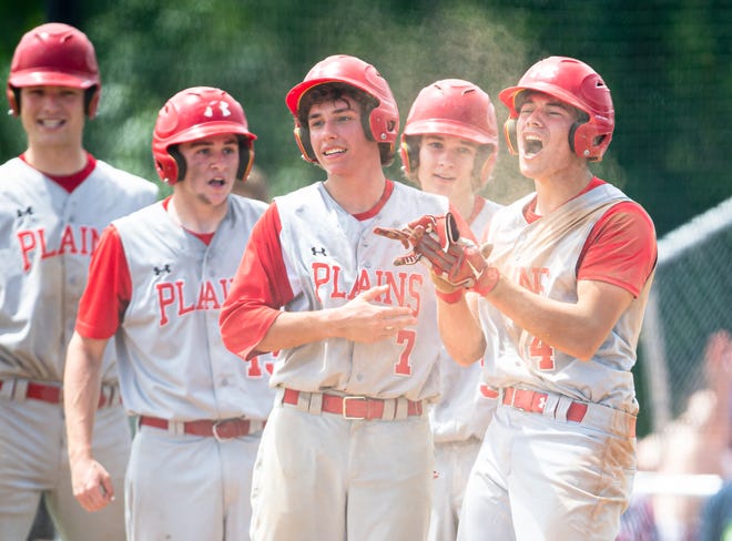Pleasant Plains High School's Joe Lee (14) and Jack Shaffer (7) celebrate after Lee beat the throw home and scored a run off a 3-RBI triple from Cam Furbeck (23) in the fifth inning in the Class 2A Pleasant Plains Sectional championship game at Reiser Field, Saturday. [Justin L. Fowler/The State Journal-Register]