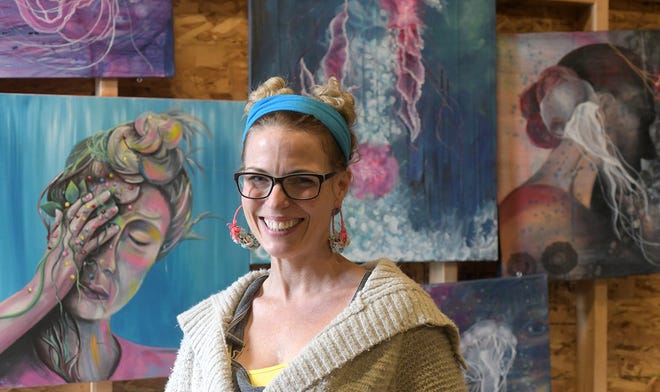 Artist Jessica McGhee stands in her Downtown Peoria studio recently. [LESLIE RENKEN/JOURNAL STAR]
