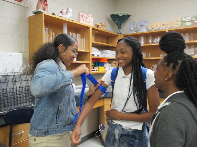 Members of Beach High School's Medical Explorer Post learn various techniques on how to stop and control bleeding during a May 8 workshop. [Submitted photo]