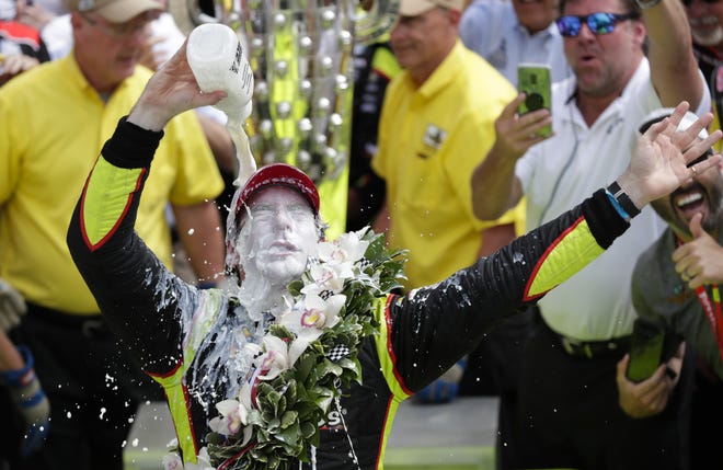 Simon Pagenaud, of France, celebrates after winning the Indianapolis 500 at Indianapolis Motor Speedway on Sunday. [Michael Conroy/Associated Press]