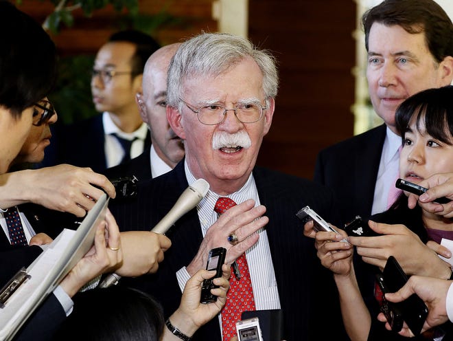 In this May 24 file photo, U.S. National Security Adviser John Bolton is surrounded by reporters at the prime minister's official residence in Tokyo, Japan. North Korea on Monday Bolton a "war monger" and "defective human product" after he called the North's recent tests of short-range missile a violation of U.N. Security Council resolutions. [YOHEI KANASAHI/KYODO NEWS/ASSOCIATED PRESS]