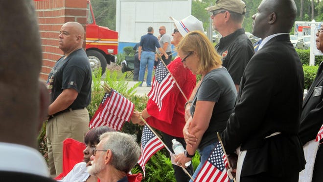 Visitors pay their respects during the annual Memorial Day observance at Heroes Park in Palm Coast on Monday. [Matt Bruce/GateHouse Florida]