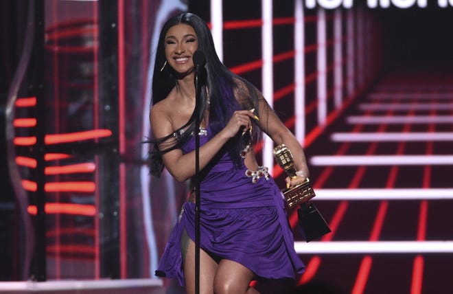 Cardi B accept the award for top 100 song for "Girls Like You" at the 2019 Billboard Music Awards. [Photo by Chris Pizzello/Invision/AP]