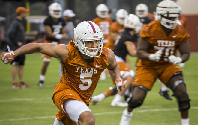 Texas wide receiver Bru McCoy (5), who famously tranferred out of USC and to Texas about a week after enrolling early at USC in January, is reportedly thinking about putting his name into the NCAA transfer portal again. [RICARDO B. BRAZZIELL/AMERICAN-STATESMAN]