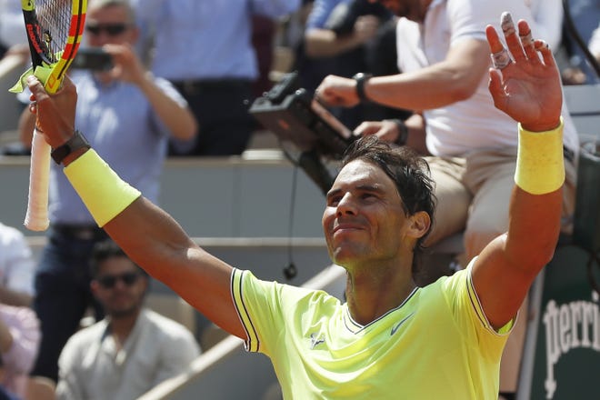 Spain's Rafael Nadal celebrates winning against Germany's Yannick Hanfmann in three sets 6-2, 6-1, 6-3, during their first-round match of the French Open tennis tournament at the Roland Garros stadium in Paris Monday. [Pavel Golovkin/Associated Press]