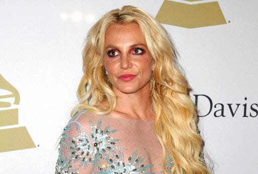 FILE - This Feb. 11, 2017 file photo shows Britney Spears at the Clive Davis and The Recording Academy Pre-Grammy Gala in Beverly Hills, Calif. A Los Angeles courtroom has been cleared of media and other audience members at a hearing on a restraining order taken out by Britney Spears against Sam Lutfi. The hearing was to seek an extension of a temporary restraining order against Lutfi, a former confidante who has been in legal battles with the family for years. Lutfi argued in documents that the order’s restraint of his speech was unconstitutional. (Photo by Rich Fury/Invision/AP, File)