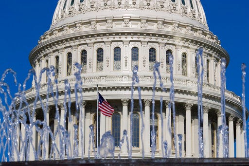 The U.S. Capitol dome is seen between a water fountain on Capitol Hill, Saturday, May 25, 2019 in Washington. (AP Photo/Alex Brandon)