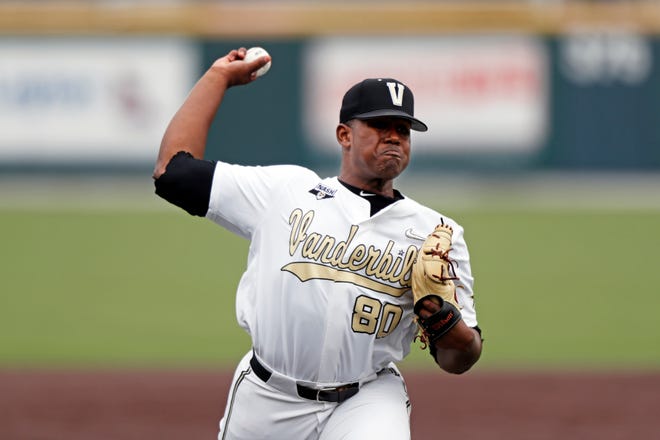 In this May 11, 2019, photo, Vanderbilt's Kumar Rocker throws to a batter during an NCAA college baseball game against Missouri in Nashville, Tenn. Rocker looks almost out of place on a pitcher's mound. The 6-foot-4, 255-pound Vanderbilt freshman played defensive end in high school, and football runs in the family. (AP Photo/Wade Payne)