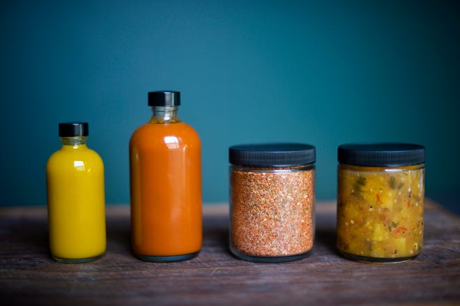 Jenny & Julio Savory CBD will launch four CBD-infused condiments tonight at The Hub, in East Greenwich: from left, El Dorado Mango Hot Sauce, Guava BBQ Sauce, Rubbernecking Rub and Grilled Pineapple Salsa.
