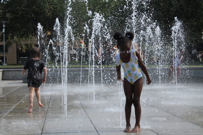 Children play in the water in Ellis Square on Tuesday. [Asha Gilbert/savannahnow.com]