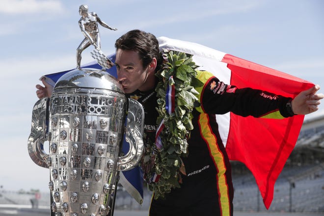 Simon Pagenaud, winner of the 2019 Indianapolis 500, poses during a photo session Monday at Indianapolis Motor Speedway. [MICHAEL CONROY/THE ASSOCIATED PRESS]