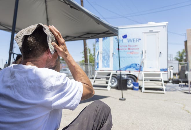 Richard, a homeless man, dries off after showering at the Victor Valley Rescue Mission in Victorville. Earlier this year, the mission began the "Showers of Blessings" mobile shower program. [James Quigg, Daily Press]