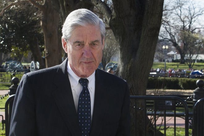 FILE - In this March 24, 2019 photo, Special Counsel Robert Mueller walks past the White House, after attending St. John's Episcopal Church for morning services, in Washington. Mueller will make his first public statement on the probe on Wednesday, May 29.(AP Photo/Cliff Owen, File)