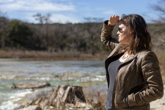 Lucy Johnson looks out over the Blanco River that runs through her family ranch near Kyle, on Jan. 28. A planned natural gas pipeline will traverse portions of the land. [STEPHEN SPILLMAN for AMERICAN-STATESMAN/FILE]