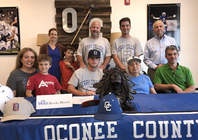 Oconee County's Brooks Blizard is joined by family at his signing ceremony on May 3, 2019 (photo by Matthew Caldwell/mcaldwell@onlineathens.com)