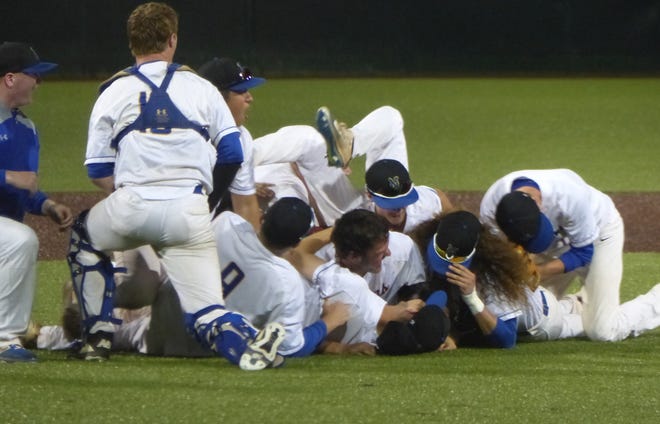 Nickerson players celebrate their 8-7 KSHSAA Class 4A Baseball State Tournament championship victory against Buhler on Tuesday at Maize High School. [Jeff Arenz/HutchNews]