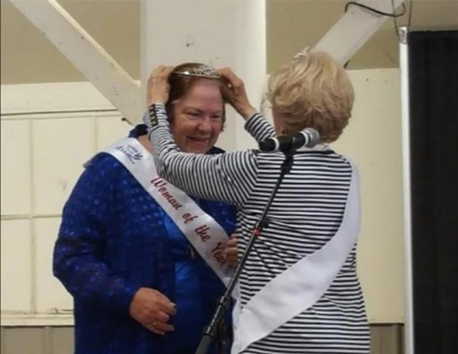 Thelma Walkington (left) was named the 2018 Ionia County Woman of the Year and crowned by 2017 Woman of the Year Linda Ciangi. [SENTINEL-STANDARD FILE PHOTO]