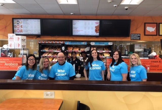 Pictured left to right: Fidelity Bank employees Mayra Regalado-Velazco, Susan Bachman, Michael Richard, Emily Daugherty, Rebecca Beaton and Brenda Woods at Dunkin' Donuts, all participated in Fidelity Bank’s Random Acts of Caring Day in Millbury May 16. [Submitted Photo]