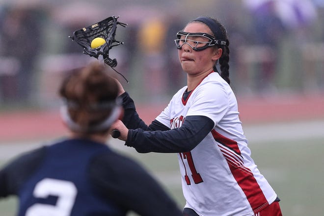 Holliston's Lily Trainor shoots and scores during a game earlier this season. Trainor tallied seven goals, including her 200th career tally, in the Panthers' 24-21 victory over non-league foe Mansfield on Wednesday. [Daily News and Wicked Local File Photo/Dan Holmes]
