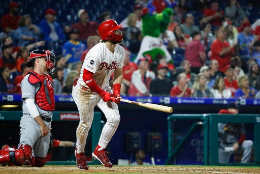 Philadelphia Phillies' Bryce Harper follows the flight of the ball after hitting a home run with one run batted in off of St. Louis Cardinals starting pitcher Genesis Cabrera during the third inning of a baseball game, Wednesday, May 29, 2019, in Philadelphia. (AP Photo/Matt Rourke)