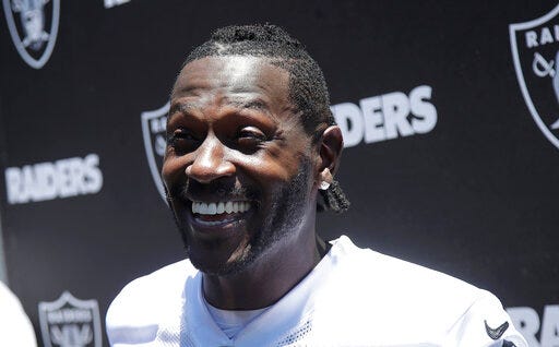 Oakland Raiders wide receiver Antonio Brown speaks to reporters after NFL football practice at the team's headquarters in Alameda, Calif., Tuesday, May 28, 2019. (AP Photo/Jeff Chiu)