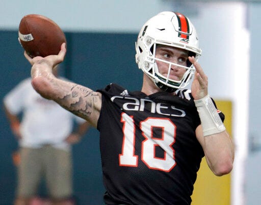 FILE - In this April 18, 2019, file photo, Miami quarterback Tate Martell (18) throws during NCAA college football spring practice, in Coral Gables, Fla. A string of recent high-profile transfers gave the college football world the impression it was getting easier for players to switch schools and compete right away. Martell to Miami, Shea Patterson to Michigan and Justin Field to Ohio State seemed to usher in a new era of free agency, but waiver approvals are still far from a sure thing. That is prompting athletes, coaches and others to complain about a process that can be somewhat mysterious. (AP Photo/Lynne Sladky, File)