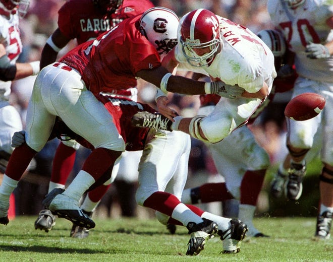 South Carolina's free safety Antione Nesmith, left, knocks the ball free from Alabama quarterback Tyler Watts during the second quarter at Williams-Brice Stadium in Columbia, S.C., Saturday, Sept. 29, 2001. (AP Photo/Morning News, James Nedock)
