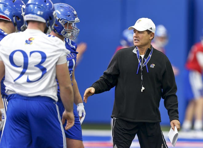 Kansas football coach Les Miles, right, and the Jayhawks open their season at 11 a.m. Aug. 31 against Indiana State, while Sunflower State rival Kansas State will play host to Nicholls at 6 p.m. Aug. 31 in its season opener. [File photograph/The Capital-Journal]