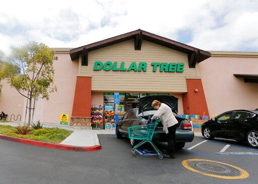 FILE - In this May 26, 2016, file photo, a shopper searches her purse outside a Dollar Tree store in Encinitas, Calif. Dollar Tree, Inc. reports financial results Thursday, May 30, 2019. (AP Photo/Lenny Ignelzi, File)