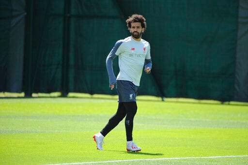 Liverpool's Mohamed Salah takes part in a training session at the Liverpool soccer team media open day, in Liverpool, England, Tuesday, May 28, 2019, ahead of their Champions League Final soccer match against Tottenham on Saturday in Madrid. (AP Photo/Rui Vieira)