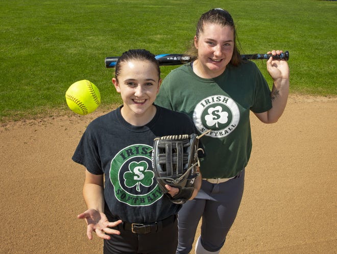 Sheldon pitcher Camille Leach (left) and catcher Emma Neuman, the Southwest Conference co-pitcher and co-player of the year, respectively, have led the Irish into the Class 6A state championship game against defending state champion Tualatin. [Chris Pietsch/The Register-Guard] - registerguard.com