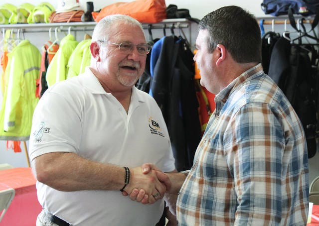 Dave Morlan shakes hands with a visitor during his party/Photo by Michael Murrell/Boone News-Republican