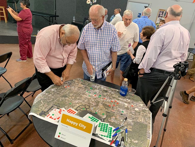 People put stickers on a map of downtown Leesburg to indicate places they liked and didn’t like. [Katie Sartoris/Daily Commercial]