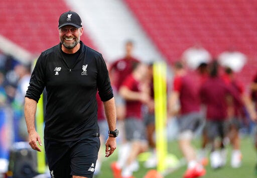 Liverpool coach Juergen Klopp smiles during a training session at the Wanda Metropolitano stadium in Madrid, Friday May 31, 2019. English Premier League teams Liverpool and Tottenham Hotspur are preparing for the Champions League final which takes place in Madrid on Saturday night. (AP Photo/Manu Fernandez)