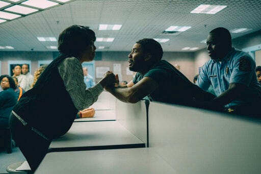 This image released by Netflix shows Niecy Nash as Delores Wise, left, and Jharrel Jerome as Korey Wise in a scene from "When They See Us." (Atsushi Nishijima/Netflix via AP)