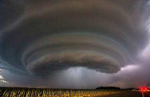 FILE - In this Tuesday, June, 26, 2018 file photo, a severe thunderstorm makes its way towards Wichita, Kan. Travis Heying, a photographer with The Wichita Eagle newspaper, captured the scene while he was chasing thunderstorms. He said that no tornadoes touched down that evening where he was shooting. “It’s just a cool, midsummer Kansas thunderstorm." It was not taken Tuesday, May 28, 2019, by the Bonner Springs, Kan., police department as tornadoes coursed through the region. (Travis Heying/The Wichita Eagle via AP)