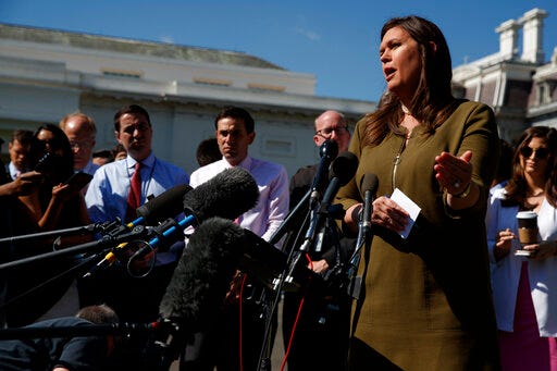 White House press secretary Sarah Sanders talks to reporters outside the White House, Friday, May 31, 2019, in Washington. (AP Photo/Evan Vucci)