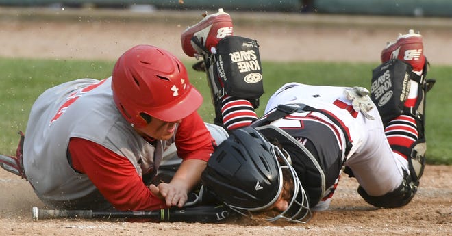 Drew Washam of Pleasant Plains scores at the plate on a collision with catcher Noe Marrero of Aurora Christian during the Class 2A semifinal game at the IHSA State Baseball Finals at Dozer Park in Peoria, Friday, May 31, 2019.[RON JOHNSON/JOURNAL STAR]