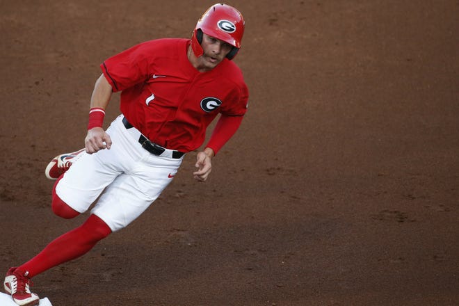 Georgia's Tucker Maxwell rounds third on his way to scoring against Mercer in the regionals Friday in Athens. [JOSHUA L. JONES/ATHENS BANNER-HERALD VIA AP]